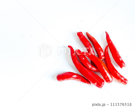 Fresh red chili and space for text on wooden background Fresh red chili and space for text on wooden background 111576518