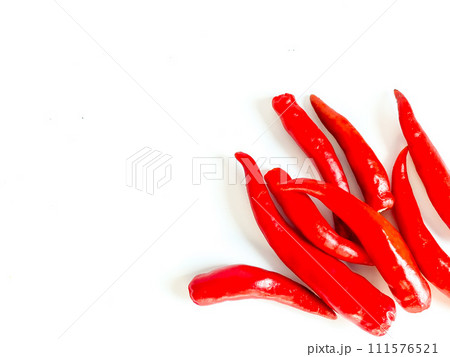 Fresh red chili and space for text on wooden background Fresh red chili and space for text on wooden background 111576521