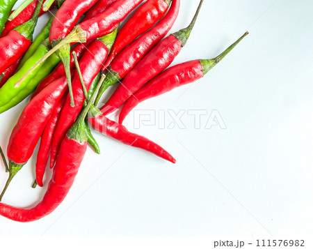 Fresh red chili and space for text on wooden background Fresh red chili and space for text on wooden background 111576982