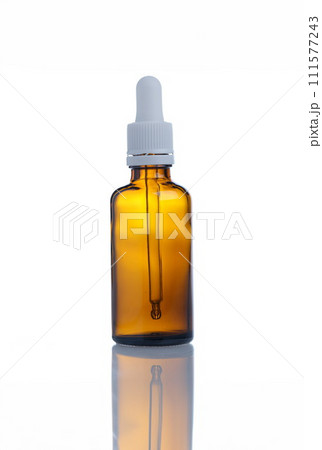 Closeup of glass bottle of cosmetic oil 111577243