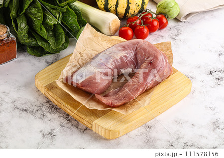 Uncooked raw pork tenderloin with spices Uncooked raw pork tenderloin with spices 111578156