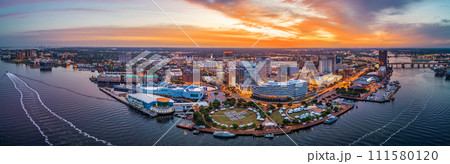 Norfolk, Virginia, USA downtown city skyline from over the Elizabeth River 111580120