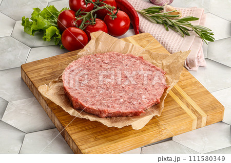 Raw beef uncooked burger cutlet 111580349
