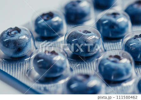 Blister with blueberries as pills. Berries instead of tablets. Natural Vitamin C supplement. Immune system boost. Tablets, pharmacy, medicine, vitamins. Health and medicine, sports nutrition concept 111580462