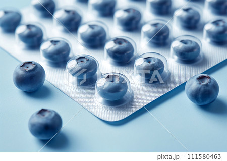 Blister with blueberries as pills. Berries instead of tablets. Natural Vitamin C supplement. Immune system boost. Tablets, pharmacy, medicine, vitamins. Health and medicine, sports nutrition concept 111580463