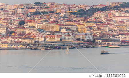 Aerial view of the Cais Do Sodre ferry terminal by the Tage river timelapse in Lisbon, Portugal 111581061