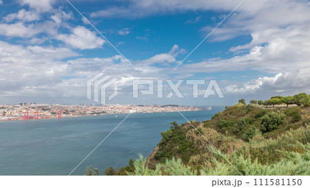 Panorama showing Lisbon cityscape and Tagus river timelapse with 25 of April bridge Panorama showing Lisbon cityscape and Tagus river timelapse with 25 of April bridge 111581150