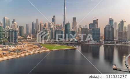 Aerial view to Dubai Business Bay and Downtown with the various skyscrapers and towers timelapse 111581277