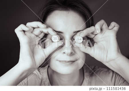 Woman with numbers 2024 instead of eyes, sepia. Woman face with figures in eyes, monochrome. Creative portrait for calendar 2024. Woman holding numbers barrels before eyes. Creativity concept. 111581436