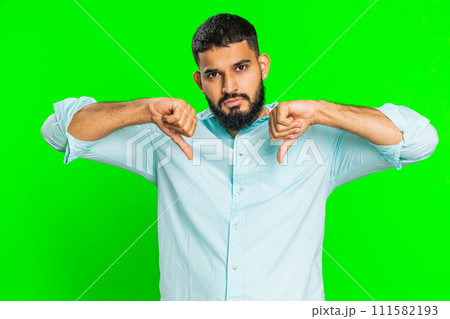 Upset man guy showing thumbs down gesture disapproval dissatisfied dislike negative feedback Upset man guy showing thumbs down gesture disapproval dissatisfied dislike negative feedback 111582193