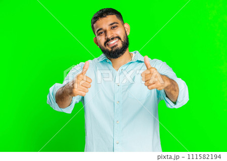Indian man raises thumbs up agrees or gives positive reply recommends advertisement likes good idea 111582194