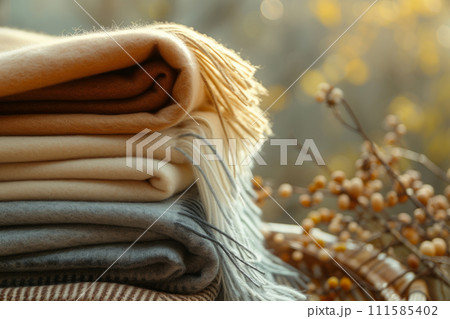Stack of wool or cashmere blankets. Autumn and winter concept. Generative AI 111585402
