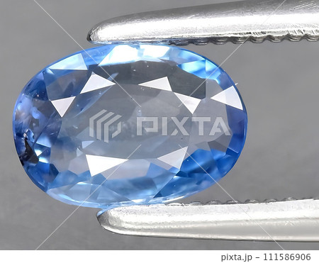 natural blue sapphire gem on the background natural blue sapphire gem on the background 111586906
