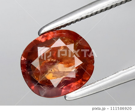 natural brown sapphire gem on the background 111586920
