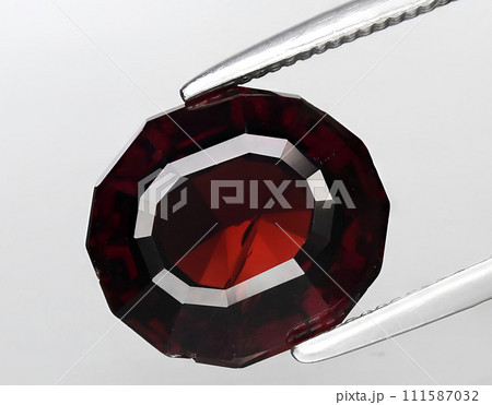 natural orange garnet gem on the background 111587032