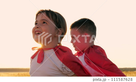 portrait girl, smile face superhero child girl, face sunset, silhouette boy girl playing superheroes red cloaks field, happy sister brother, child kid in carnival costumes, girl boy playing superhero 111587628