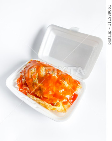 Omelet with pork and chili sauce on rice in the white food tray Omelet with pork and chili sauce on rice in the white food tray 111589061