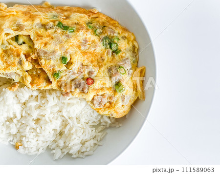 Omelet with pork and chili on rice on  the white background 111589063