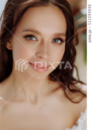 Portrait brunette woman, smiling and looking confident in camera. Portrait brunette woman, smiling and looking confident in camera. 111593038