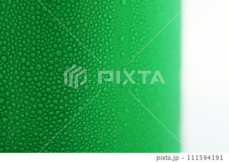 water drop on green beverage cans background, texture of cold aluminium package water drop on green beverage cans background, texture of cold aluminium package 111594191