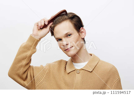 Modern Lifestyle: Handsome Caucasian Guy with Trendy Hairstyle in Studio Portrait Modern Lifestyle: Handsome Caucasian Guy with Trendy Hairstyle in Studio Portrait 111594517