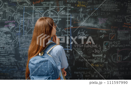 Teenager in class on background of blackboard 111597990