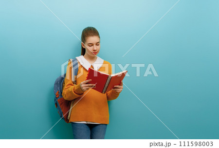 teenager on color paper wall background teenager on color paper wall background 111598003