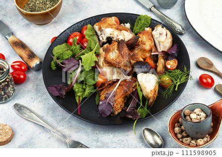 Appetizing slices of baked chicken. Appetizing slices of baked chicken. 111598905