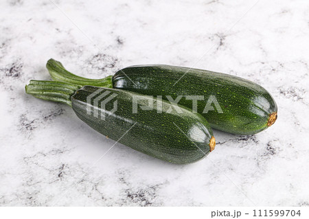Sliced raw young green zucchini 111599704