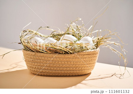 Wicker basket with farm natural white eggs. Wicker basket with farm natural white eggs. 111601132