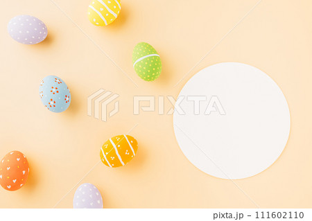 Overhead easter eggs and circle white paper isolated on pastel background with copy space, decoration paper round blank, Happy Easter Day, composition banner web design holiday background, flat lay Overhead easter eggs and circle white paper isolated on pastel background with copy space, decoration paper round blank, Happy Easter Day, composition banner web design holiday background, flat lay 111602110