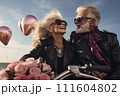 romantic senior family. couple of smiling mature people  on a on a motorcycle in leather jackets 111604802