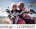 Portrait of an mature couple of women with dark skin on a motorcycle valentine's Day concept 111604825