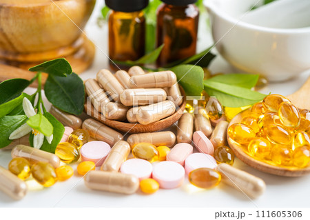 Alternative medicine herbal organic capsule with vitamin E omega 3 fish oil, mineral, drug with herbs leaf natural supplements for healthy good life. Alternative medicine herbal organic capsule with vitamin E omega 3 fish oil, mineral, drug with herbs leaf natural supplements for healthy good life. 111605306