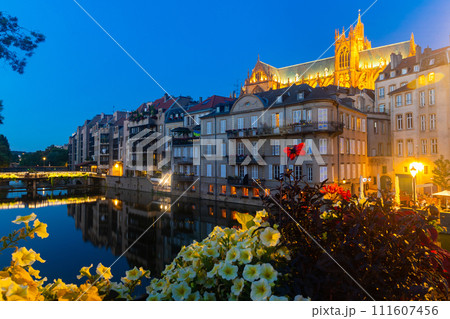 Metz cityscape at nigh with illuminated Cathedral on bank of Moselle River Metz cityscape at nigh with illuminated Cathedral on bank of Moselle River 111607456