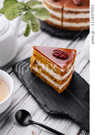 Delicious cheesecake with caramel and walnuts 111607681