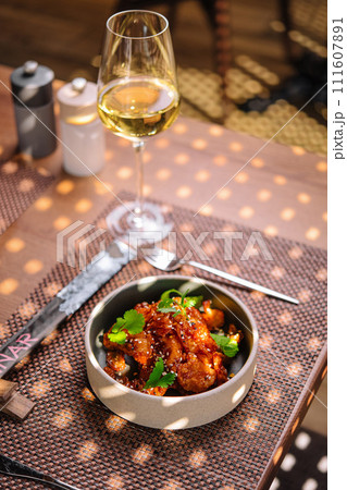 Gourmet fried squid Yakuza and sesame and glass of wine Gourmet fried squid Yakuza and sesame and glass of wine 111607891