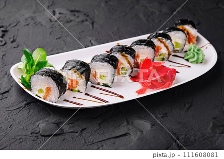 nori sushi rolls with salmon on plate nori sushi rolls with salmon on plate 111608081