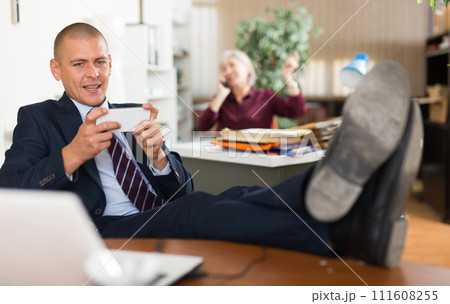 Man office worker using smartphone during break 111608255