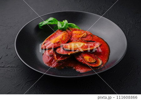 Cooked Mussels with hot spiced sauce 111608866