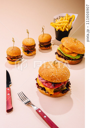 large and mini burgers with fries large and mini burgers with fries 111608907