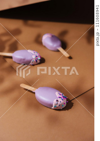 popsicle ice cream in purple glaze popsicle ice cream in purple glaze 111608941