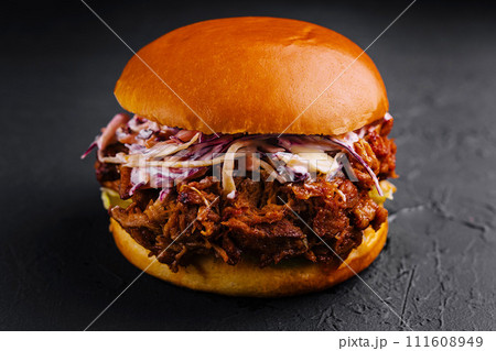 Pulled pork sandwich on black stone Pulled pork sandwich on black stone 111608949
