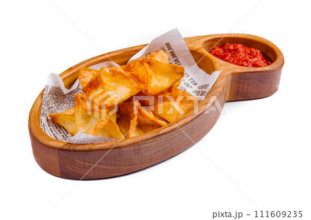potato crisps with hot sauce isolated 111609235