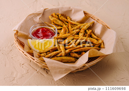 fried fish with lemon and ketchup fried fish with lemon and ketchup 111609698