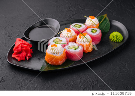 sushi rolls wrapped with salmon and tuna 111609719