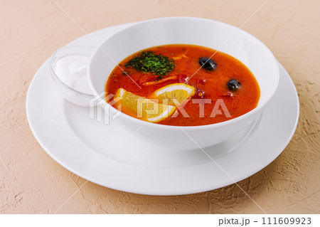 soup solyanka closeup in a bowl soup solyanka closeup in a bowl 111609923
