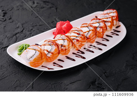Philadelphia sushi rolls on black stone 111609936