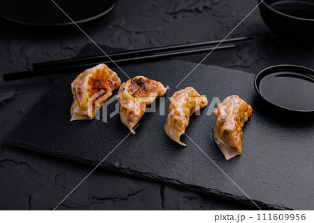 Gyoza or dumplings snack with soy sauce Gyoza or dumplings snack with soy sauce 111609956