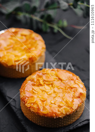 Almond muffins on black board 111610965